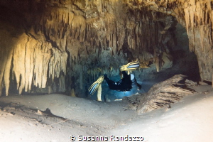 exploring cave stalagmites by Susanna Randazzo 